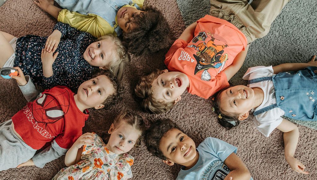 group of children laying on the floor