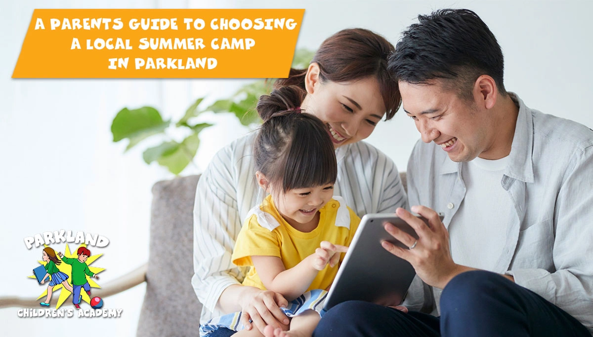 parents and toddler daughter looking at a tablet