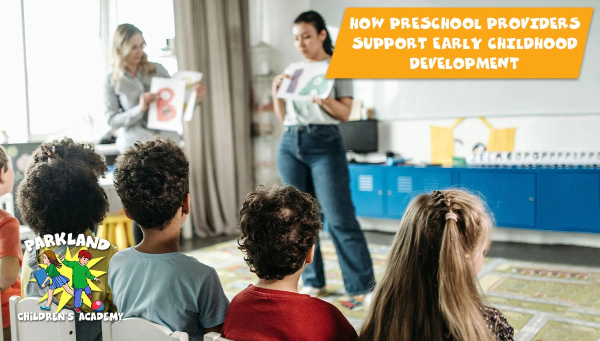 teachers showing books to preschool children