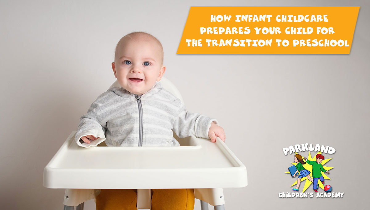 infant in a high chair smiling